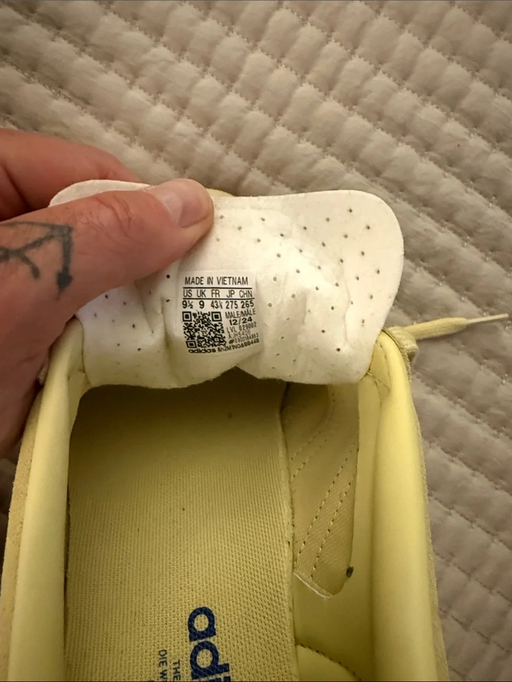Pale yellow Adidas Gazelles with blue stripes